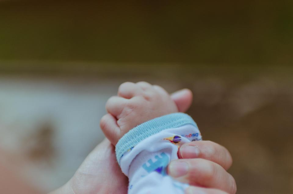 A newborn baby representing new baby gifts